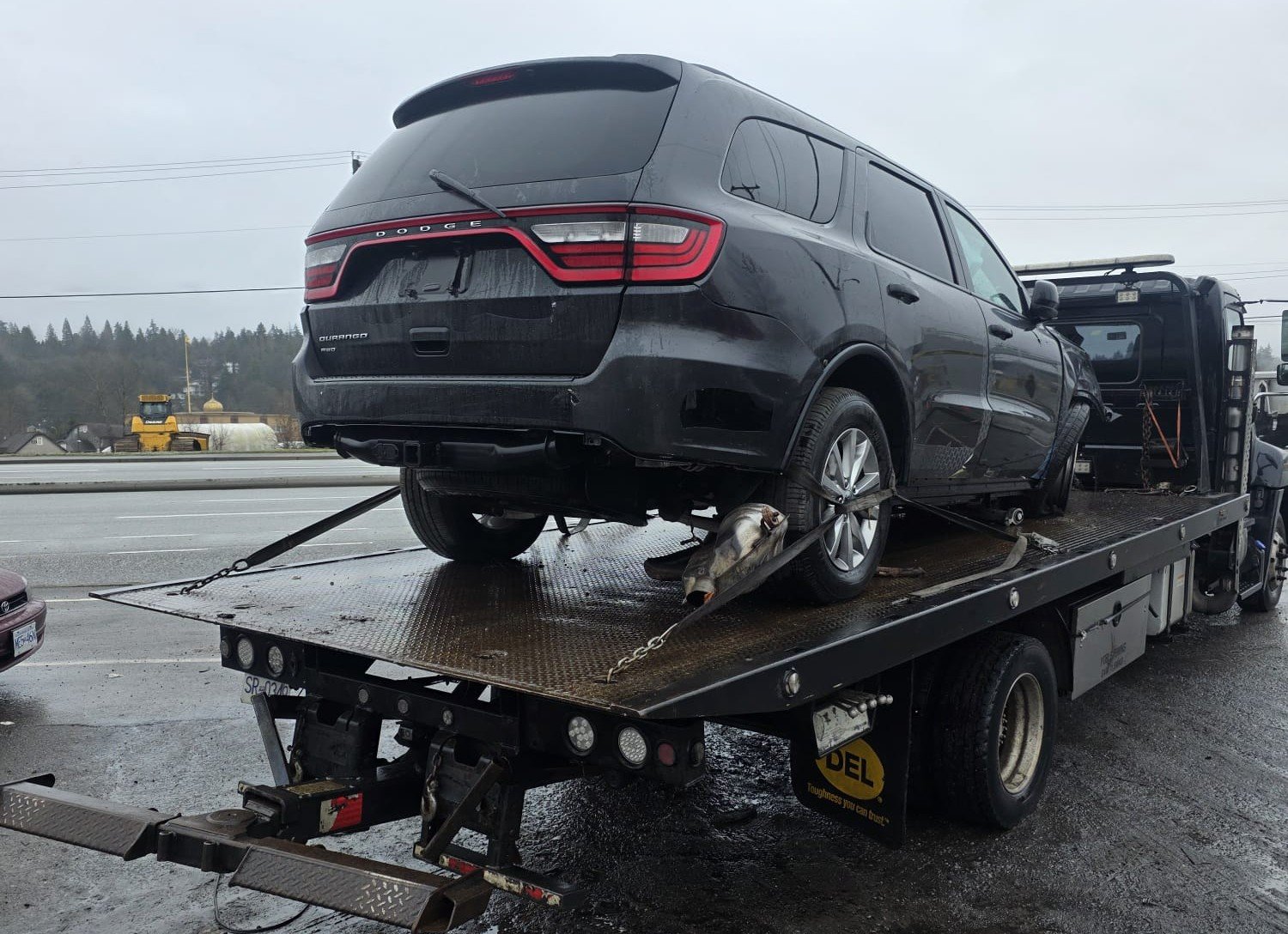 Scrap SUV being loaded for removal by Noble Cash For Car Guys in Surrey BC
